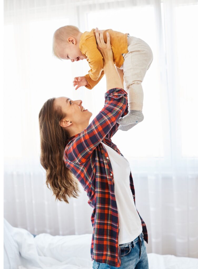 mother child baby having fun family happy childhood care cheerful cute boy son love cheerful young woman