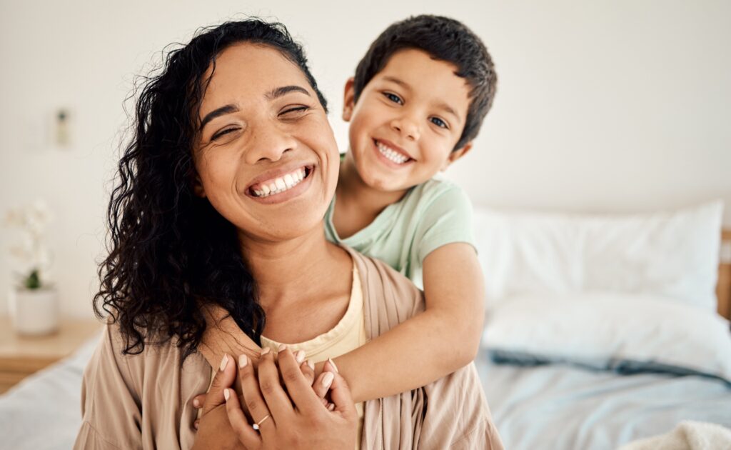 Smiling woman with healthy, glowing skin — the payoff of switching to an all natural face moisturizer